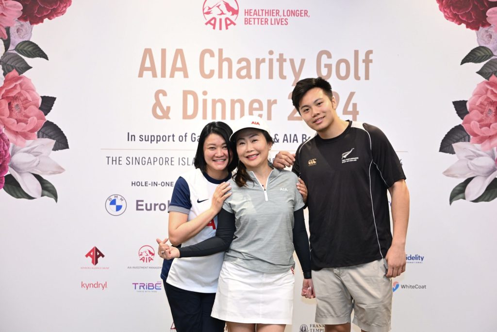 Juanna and Jeron with their client at AIA Charity Golf and Dinner Event 2024